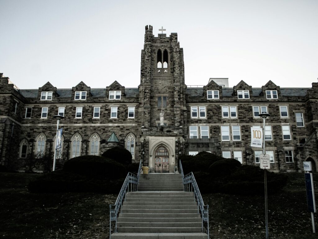 Stone facade of a Gothic-style building with a tower in London, Ontario, Canada.